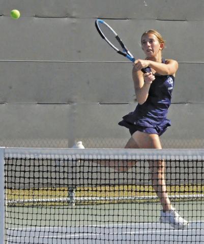 CALDWELL’S KYLIE VOGLER returns the ball during the Hornets’ team tennis regional semifinal match against Franklin last Thursday. Tribune photo by Denise Squier
