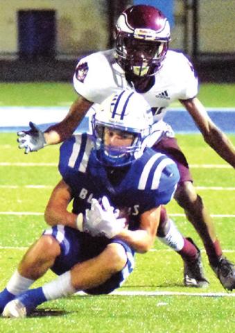 LANCE LARA makes a catch during the Snook-Hearne game last Friday in Snook.