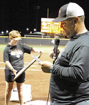 MARCUS ESCALANTE gives a speech honoring Wendy Weiss last Friday night. Weiss will be retiring at the end of this school year after coaching 29 years for the Lady Hornets.