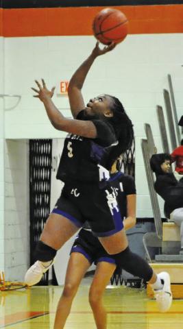 BRAYNIJA POOL flies to the hoop during the Snook-Somerville rivalry game last Tuesday. Tribune photo by Denise Squier