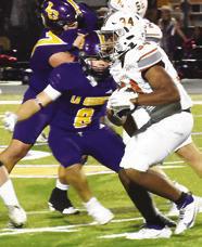 MICHAEL BUTLER carries the ball for Caldwell against La Grange.