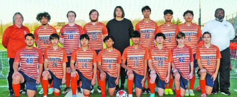 THE 2023 CALDWELL HIGH SCHOOL HORNET VARSITY SOCCER TEAM is, from left, front, David Lopez, Alex Reyes, Nam Le, Benjamin Jaimes, Quetzacoatl Bautista, Francisco Martinez, Mark LaSeur, David Goff, back, Coach Burt Yates, Steven Amaya, Barret Yates, James Coston, Nicholas Rutherford, Jeffrey Tobias, Daniel Morales, Jose Alvarez and Coach Wayland Jenkins. -- Photo courtesy of Dianne Pursch Photography