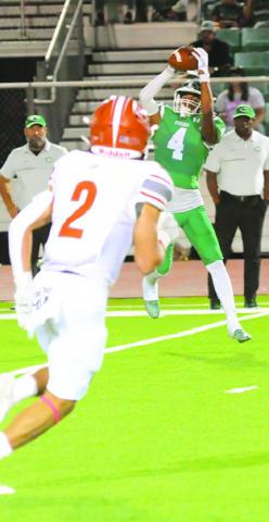 CALDWELL’S BLANE Garza moves in for a tackle as a Cuero receiver makes a catch.