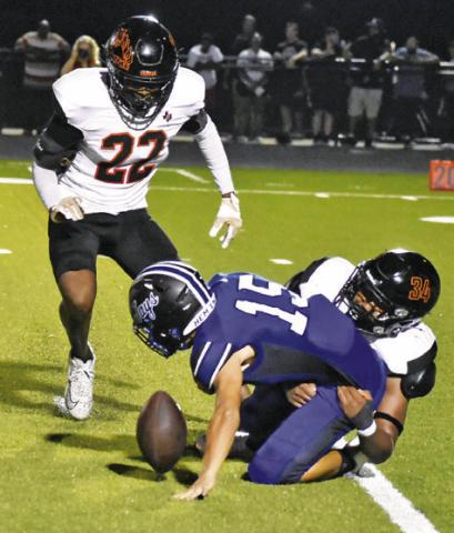 SOMERVILLE’S JAYDEN ESPINOSA and Semaj Pennygraph move in to tackle Snook’s Braedyn Fannin as the ball comes loose. Tribune photo by Roy Sanders