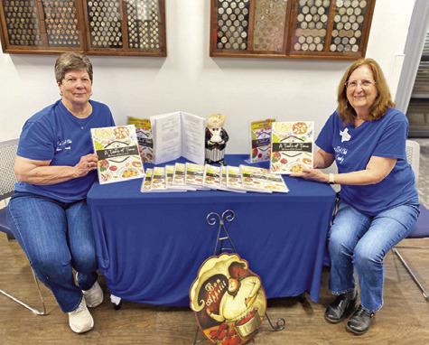 BRENDA KOLOJACO AND Debbie Schumacher pose for a photo for the Lyons Extension Education Association cookbook fundraiser. The cookbook sales will benefit the Lyons EEA Scholarship Fund. Photo courtesy of Lyons EEA