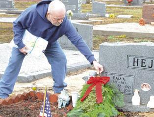 SWAGS AND WREATHS were placed on veterans’ grave in the Snook Cemetery as part of the Wreaths Across America campaign. The event was headed by the Snook Extension Education Association (EEA). Tribune photo by Denise Squier