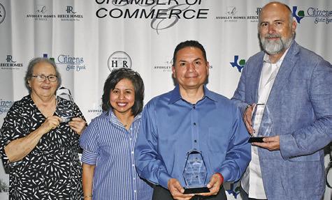 AWARD WINNERS GATHER after the chamber banquet. They included, from left, Ann Sebesta, Woman of the Year, Danny Segundo, Advocate of the Year, and Johnny Price Jr., Man of the Year. Joining them is Chamber Executive Director Susan Mott.