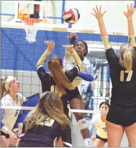 SNOOK’S JAIVAN STRINGFELLOW kills the ball during Snook’s loss to Round Top-Carmine on Tuesday in Snook. Stringfellow had 11 kills during the four-set loss. -- Tribune photo by Denise Hornaday