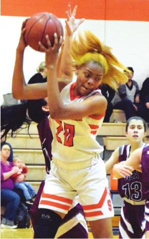 XADRIA MARTIN had her second doubledouble in the past two weeks during Somerville’s 47-25 home win over Iola Friday night. She is pictured pulling down one of her 15 rebounds. -- Tribune photo by Denise Hornaday