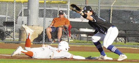 CALDWELL’S ZANE BROWN slides to base against Anderson Shiro at the tournament. Caldwell won 8-3. -- Tribune photo by Denise Squier