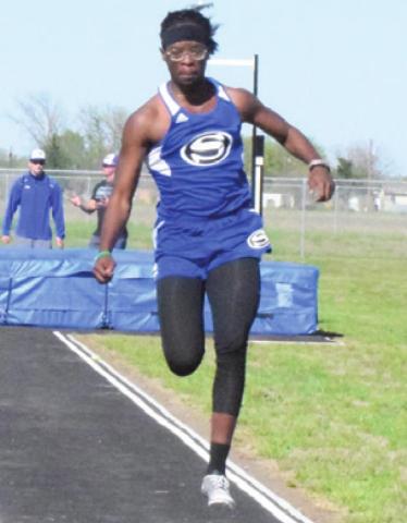DALVON WORKMAN competes in the triple jump during the Snook Track Meet last Thursday. -- Tribune photo by Denise Squier