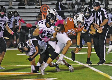 QUARTERBACK KORBIN BURNS carries for Caldwell against Giddings. The Hornets won 44-14 in their district opener. Tribune photo by Roy Sanders