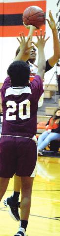 XADRIA MARTIN NETS her third consecutive double-double against Hearne on Friday, scoring 10 points and pulling down 12 rebounds. -- Tribune photo by Denise Hornaday