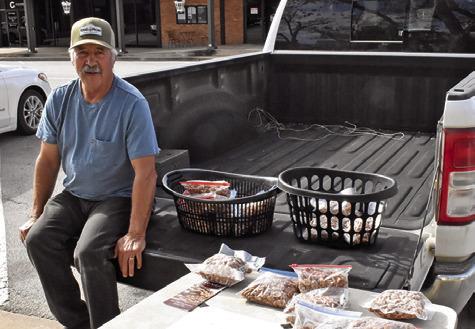 BILL REE SELLS pecans on Saturday, Nov. 15, at the Caldwell Farmers Market in downtown Caldwell. The market is held on Saturdays.