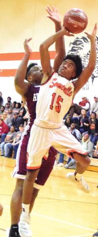 SOMERVILLE’S Verkobe Woodberry’s shot is about to be blocked by Hearne’s Anthony Jackson. -- Tribune photo by Denise Hornaday