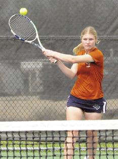 JORDAN PERKKIO returns the ball during the Caldwell Varsity Tennis Tournament last week. Tribune photo by Denise Squier