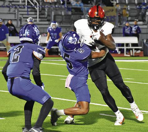 Tribune photo by Roy Sanders KEITH CRAWFORD OF Somerville carries the ball against Ben Bolt.
