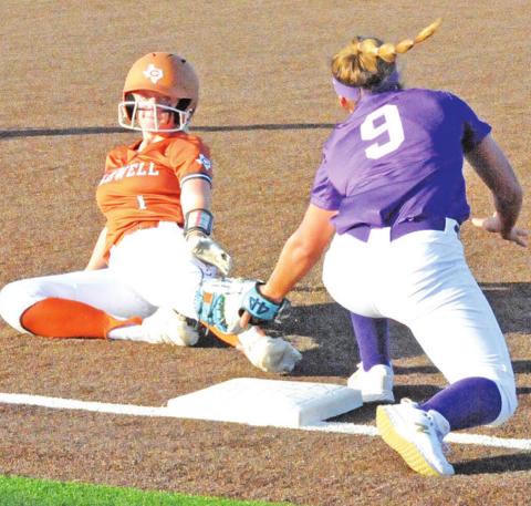 CALDWELL’S CAITLYN FAUST slides under the tag of the Florence third baseman during the Lady Hornets ‘s 15-8 win over the Lady Buffs at Lady Hornet Field. -- Tribune photo by Denise Squier