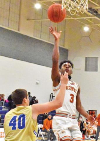 CALDWELL’S DONTAVIEN Johnson takes a shot in the Hornets victory over Rockdale. -- Tribune photo by Roy Sanders
