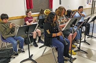 THE SNOOK SECONDARY BAND performed during the March 24 Snook School Board Meeting. Tribune photo by Denise Squier