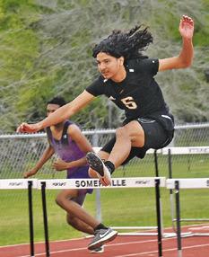 GARDNER SHIVERS jumps over this hurdle during the Koppers Relays last week.