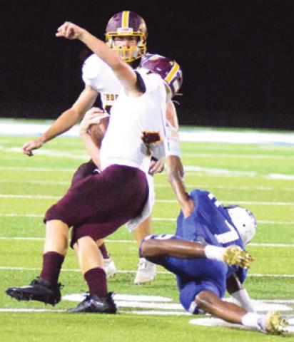 SNOOK’S DESHUN Hamilton holds onto the jersey of Thorndale’s Cain Brymer to make a tackle during the Bluejays’ home opener last Friday. -- Tribune photo by Denise Hornaday