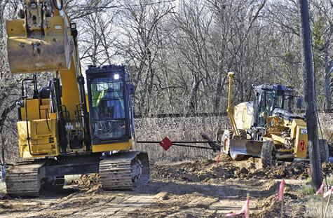 LARRY YOUNG PAVING works on Kleb Street for the City of Caldwell’s street and drainage paving project. The project is part of the GLO-Hurricane Harvey MIT-MOD program. Tribune photo by Roy Sanders