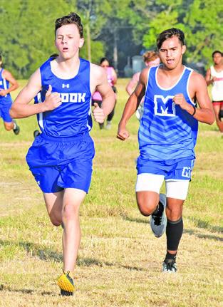 ETHAN JANAC WON THE boys’ varsity title at last week’s District 26-2A Cross Country Meet at the Snook City Park.