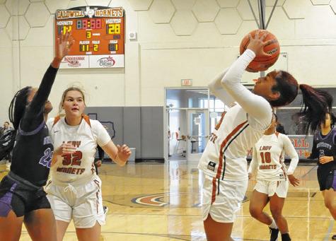 CALDWELL’S AVELYNN O’RILEY shoots over a Waco University defender during their game last Monday at Hornet Gym. Tribune photo by Denise Squier