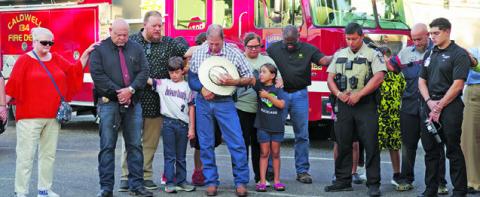 MANY COMMUNITY MEMBERS AND members of Caldwell Methodist Church prayed for area first responders and over their vehicles last Wednesday for Patriots Day. Photo courtesy of Steve Ingram