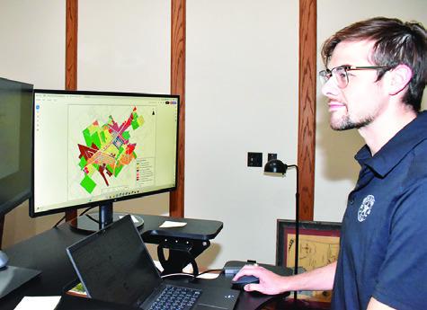 FORREST WILLIAMS LOOKS at this computer map at city hall.