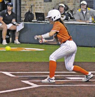 JAELYN GEST BUNTS the ball during the Caldwell-Sealy bi-district game on Thursday. Tribune photo by Denise Squier