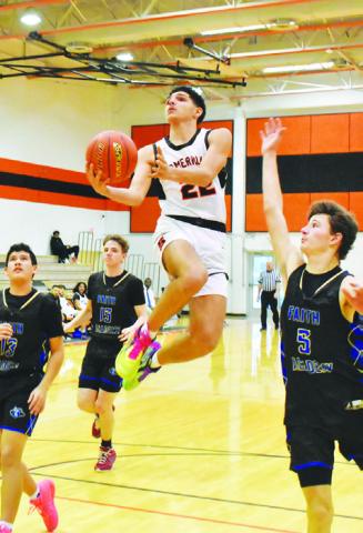 GAVIN WILLIAMS OF Somerville leaps high for this shot against Bellville Faith Academy. -- Tribune photo by Roy Sanders