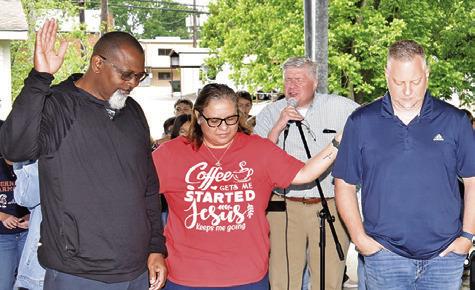 PRAYERS ARE OFFERED for the clergy at the National Day of Prayer celebration on May 2 at the pavilion in Caldwell.