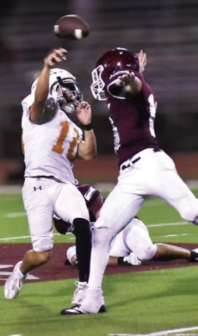 KORBIN BURNS gets this pass away just in time as a Troy defender moves in. Tribune photo by Roy Sanders