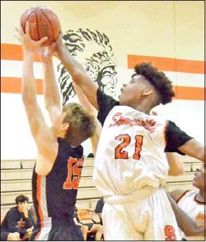 DOMINIC TUCKER of Somerville fights for this rebound against Centerville at the Somerville Tourney. -- Tribune photo by Roy Sanders