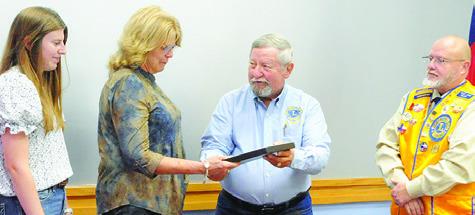 THE CALDWELL BURLESON COUNTY Lions Club recently honored the late Burleson County Sheriff Gene Hermes during its November meeting at the Caldwell Civic Center. Pictured, from left, are Caylee Hermes, Sherri Hermes, Lion Adrien Drouilhet and Lion Ken Wiltz. Tribune photo by Denise Squier
