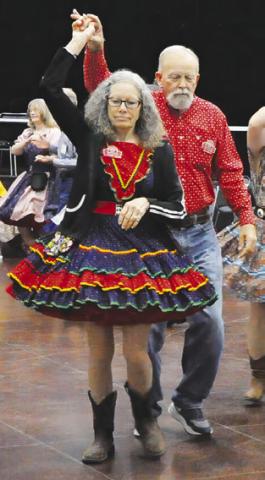AREA SQUARE DANCERS put on an exhibition last week at the Caldwell Civic Center, including dancing with area children. Tribune photo by Denise Squier