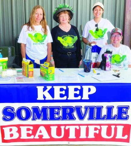 MELISSA YOUNG, KATHY Pollock, Norma Medina and Fran Pack work on Saturday during the city-wide cleanup effort.