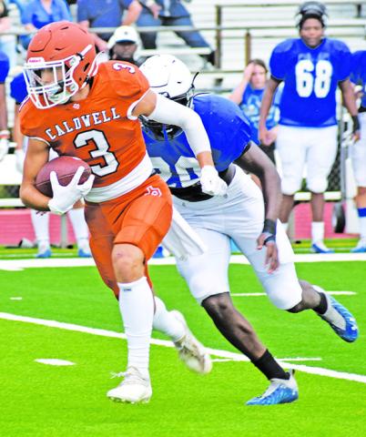CALDWELL’S KOY Becka carries the ball against Navasota in the scrimmage.