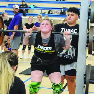 SOMERVILLE’S CHEYENNE LEWIS lifts during Saturday’s Somerville Invitational Powerlifting Meet held in the Yegua Center. Tribune photo by Denise Squier