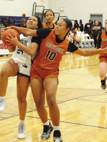 SNOOK’S ALANA Stringfellow is fouled by Caldwell’s Ava Jones during the fourth quarter of the Caldwell-Snook game in the Caldwell Lady Hornet Basketball Tournament last week.