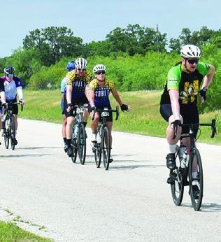 BIKERS RIDE DOWN Thornberry Street in Somerville on Sunday, April 27, as part of the MS-150 ride. The event raises funds for Multiple Sclerosis research, drawing bikers from the Austin and Houston areas, concluding at Kyle Field at Texas A&amp;M University in College Station.