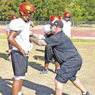 DEMONSTRATIONS on blocking and more were featured during last week’s Yegua football practice. -- Tribune photo by Roy Sanders.