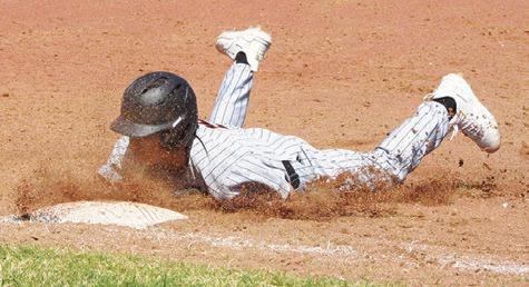 BARRETT HOWE OF Somerville slides into base against St. Joseph at the Somerville Tournament. -- Tribune photo by Denise Squier