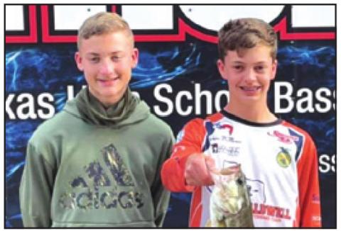 COOPER ODENBACH and Grant McManus show off their catch of the day at the Texas High School Bass Association’s tournament at Lake Conroe on Saturday, March 13.