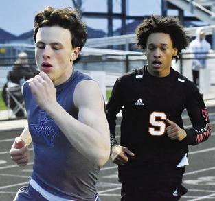 SNOOK’S ETHAN Janac and Somerville’s Jeremy Vela run in the 800-meter run. Vela wins the race with a time of 2:17.31. Janac finishes third with a time of 2:18.65.