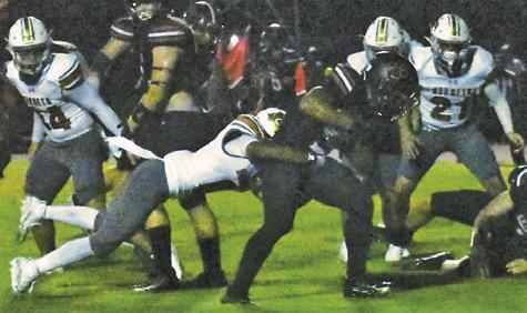 ROGELIO HERNANDEZ MAKES a tackle for Caldwell last Friday against Brazos in Wallis. Caldwell lost its opener 40-0. Tribune photo by Roy Sanders