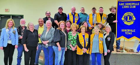 THE LAKE SOMERVILLE LIONS Club held its Charter Night dinner, sponsored by the Caldwell Burleson County Lions Club on Thursday, Jan. 29, at the Burlson County Expo Center. District Governor Kelli Higgins (first row, far left) and Club President Jason Rhodes (top row, far right) participated in the charter signing ceremony. Past District Governor Lisa Free Martin (first row, far right) was the installing officer.