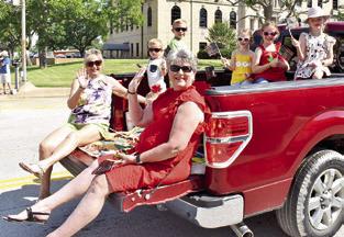 ANNA SCHIELACK AND Sharon Burgess ride in the Juneteenth Parade on Saturday in Caldwell. Anna is joined by grandchildren Dottie, Pearl, Aspen, Lesly and Oliver, and Sharon is joined by grandchildren Crew Morton and Cutter Morton. -- Tribune photo by Roy Sanders